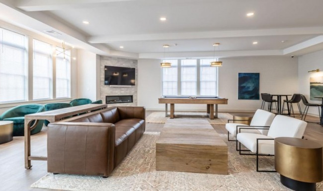 a lounge with a large rug